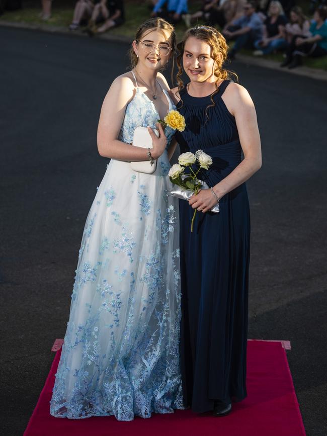 Charli Cameron (left) and Rosemary Sherwood arrive at Harristown State High School formal at Highfields Cultural Centre, Friday, November 18, 2022. Picture: Kevin Farmer