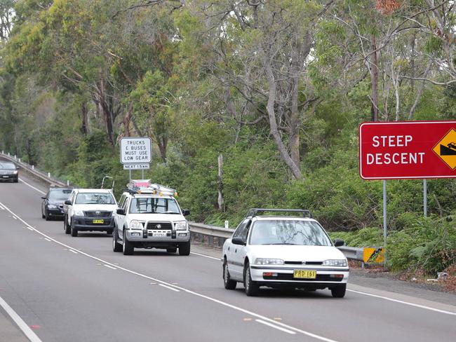 New signs have been placed beside Mona Vale Rd at Ingleside warning eastbound heavy vehicles of the steep slope ahead. The signs are in response to the crash of a petrol tanker at the foot of the hill that killed two people on October 1 last year. monax Picture: Ward Adam