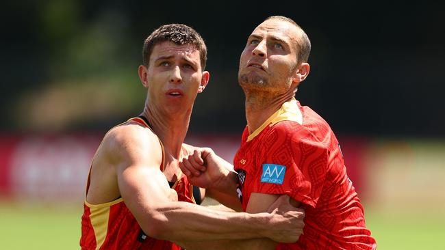 GOLD COAST, AUSTRALIA - NOVEMBER 25: Jarrod Witts and Max Knobel during a Gold Coast Suns AFL training session at Austworld Centre Oval on November 25, 2024 in Gold Coast, Australia. (Photo by Chris Hyde/Getty Images)