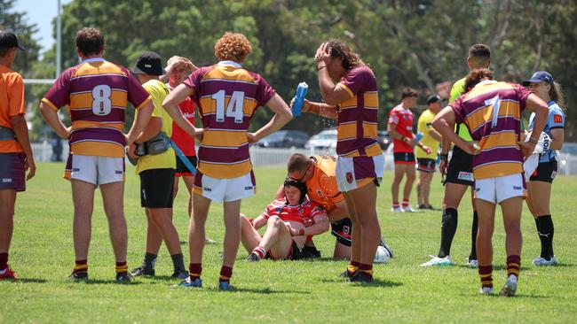 Josiah Clifford gets treatment. Picture: Adam Wrightson Photography