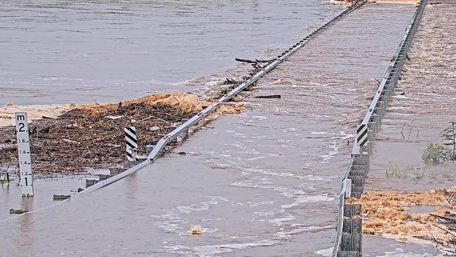 Whitsundays flood cameras show the Don River submerging the Inversion Road Bridge, Bowen this morning