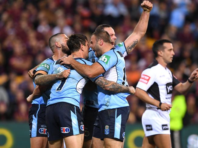 Mitchell Pearce of the NSW Blues reacts with players after scoring a try during Game 1 of the State of Origin series at Suncorp Stadium in Brisbane, Wednesday,  May 31, 2017. (AAP Image/Dave Hunt) NO ARCHIVING