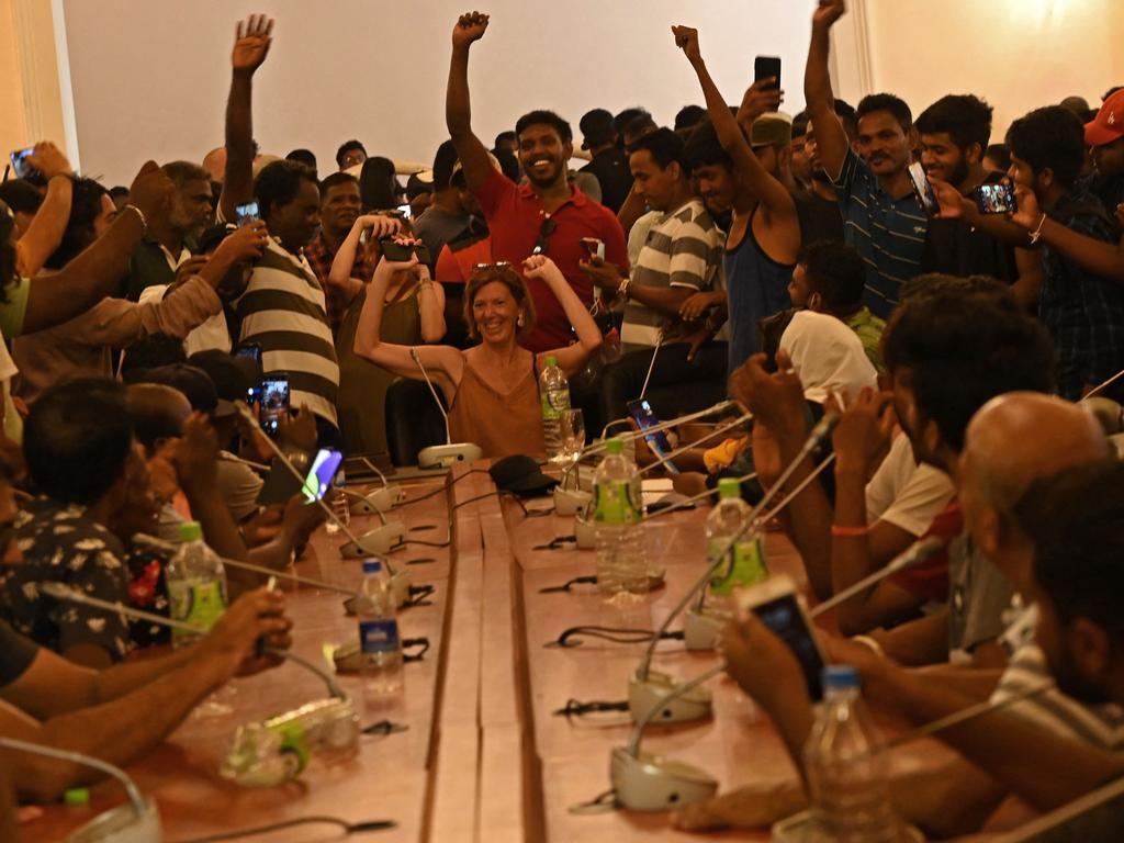 People crowd inside Sri Lanka's presidential palace in Colombo, a day after it was overrun by anti-government protesters. Picture: AFP