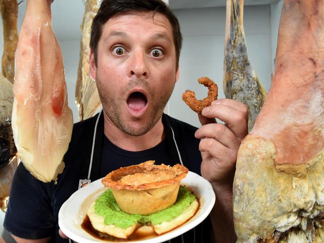 Michael Hermans with the pub’s possum pie, which comes complete with crumbed tail. Picture: Kylie Else