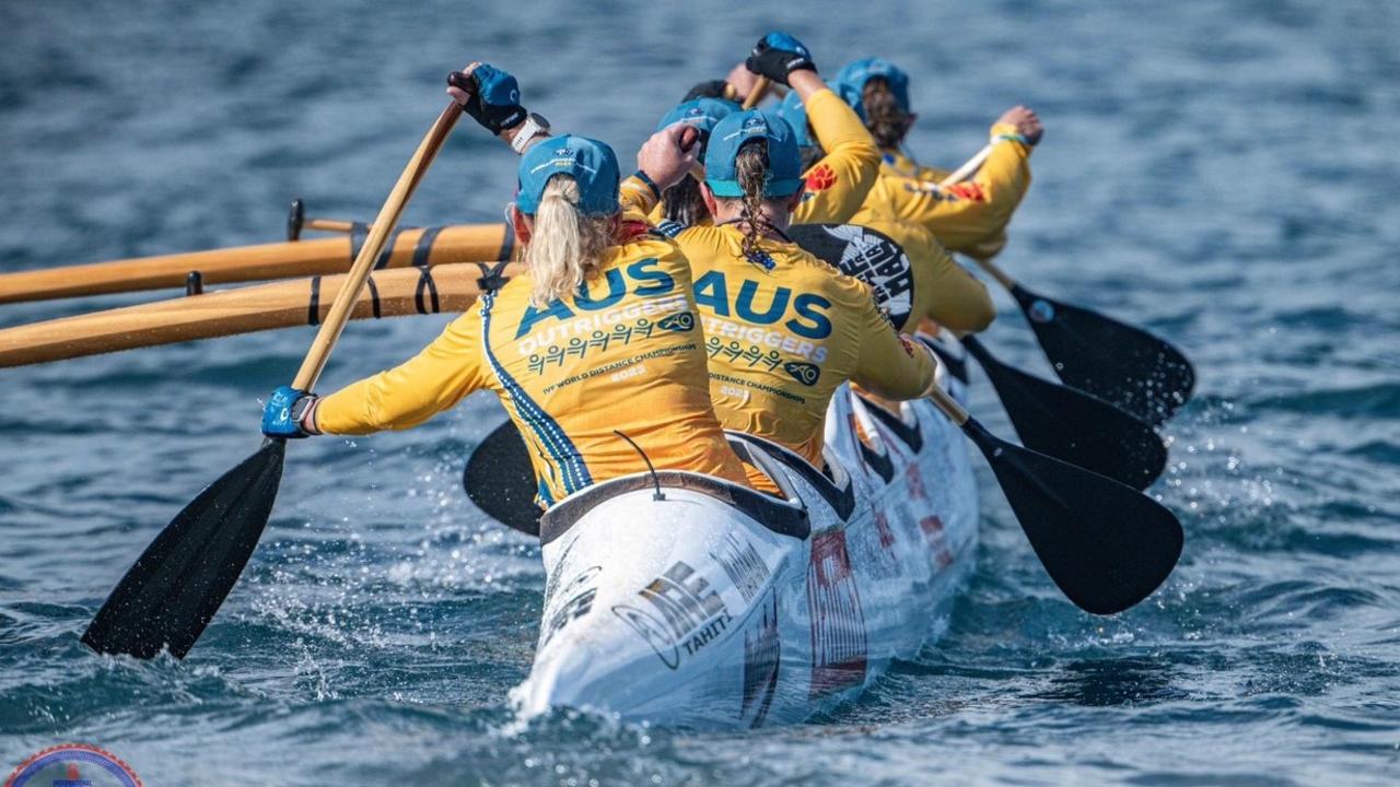 Kathy Barsby (second from back) and her Australian Masters 50 teammates power through the water on their way to victory. Photo: International Va'a Federation