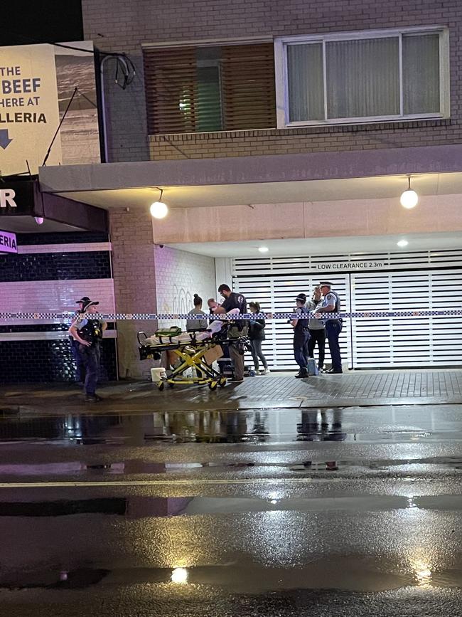 NSW ambulance crews getting a stretcher ready for one person injured at the apartment fire on Enmore Rd, Newtown. Picture: Paul Brescia