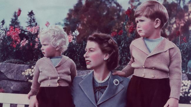 Queen Elizabeth II with children Charles and Anne at Balmoral in 1952. Picture: Getty Images