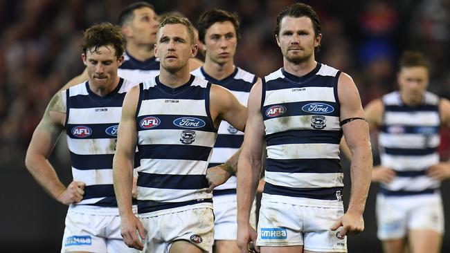 Joel Selwood leads his team off the MCG after losing to Melbourne.