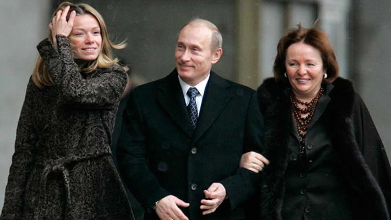 Vladimir Putin with his wife Lyudmilla (right) and his daughter Mariya Putina.