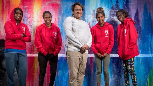 Cathy Freeman with James, from Tiki Islands; Tkai from Palm Island, Rhianon , from Woorabinda and Rhonda from Elcho Island. Picture: Jake Nowakowski