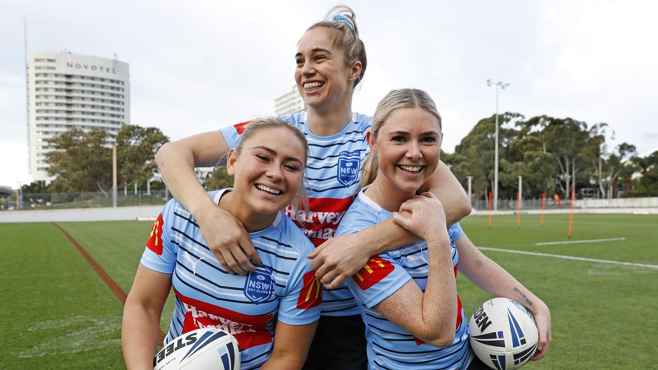 Studdon (right) with Blues teammates Keeley Davis and Kezie Apps.