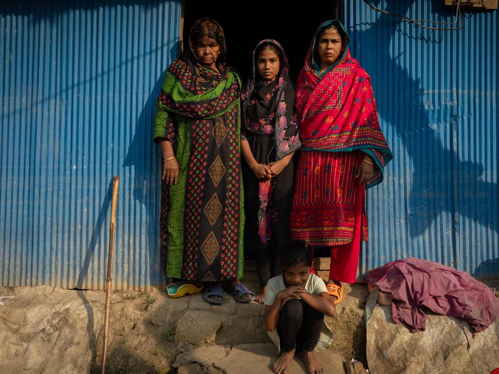 L-R Rabeya 65 (grandmother) Afaya Khatun, 30 (mum) and Afroza Akter Jui ,12 had their home flooded right through during the floods and still cannot afford to fix the broken roof. UNICEF has built a flood resistant latrine in the compound of their home. The three generations life in the same house. Hasanpur village in Feni, Bangladesh, was flooded in August 2024, resulting in widespread damage to homes, toilets and clean water facilities. Picture: Jason Edwards