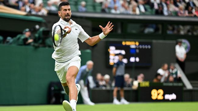 Serbia's Novak Djokovic returns the ball to Czech Republic's Vit Kopriva during their men's singles tennis match on the second day of the 2024 Wimbledon Championships.