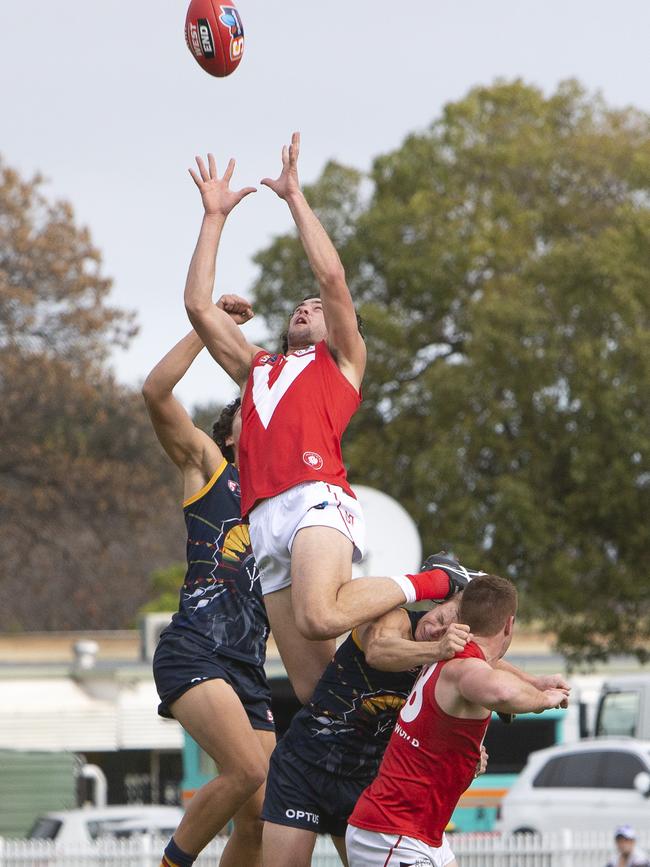 North Adelaide’s Karl Finlay flies high for a mark against the Crows at Prospect Oval. Picture: Emma Brasier