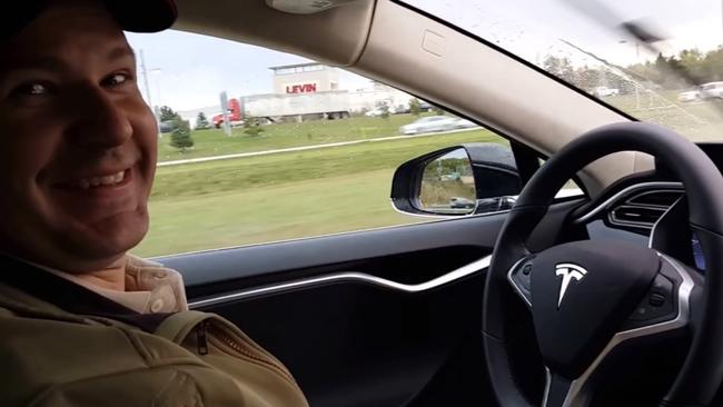 Joshua Brown in the driver's seat of his Tesla Model S with no hands on the steering wheel while he demonstrates the car's self-driving mode. Brown was killed on May 7 when his car hit a tractor-trailer while it was on the autopilot system. Picture: YouTube via AP