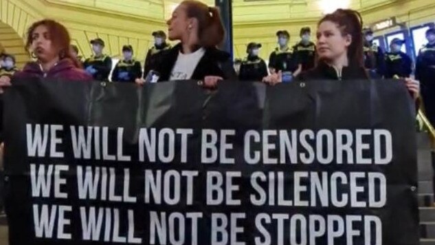 Protesters are seen in Melbourne’s CBD last night. Picture: Twitter