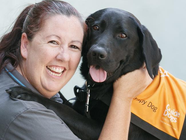 Fiona Lamont out front of Sutherland Court with therapy dog "China".Guide Dogs NSW/ACT is involved in a pilot of canine support program in the ACT Magistrates Court. They have Therapy Dogs and a handler engage with parties, witnesses and other people involved in court proceedings to minimize stress and anxiety.Photo: Tim Pascoe