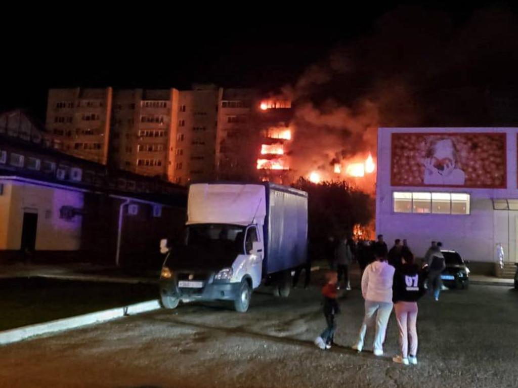 The apartment building on fire after a Russian military plane crashed into a residential area of the town of Yeysk. Picture: Supplied