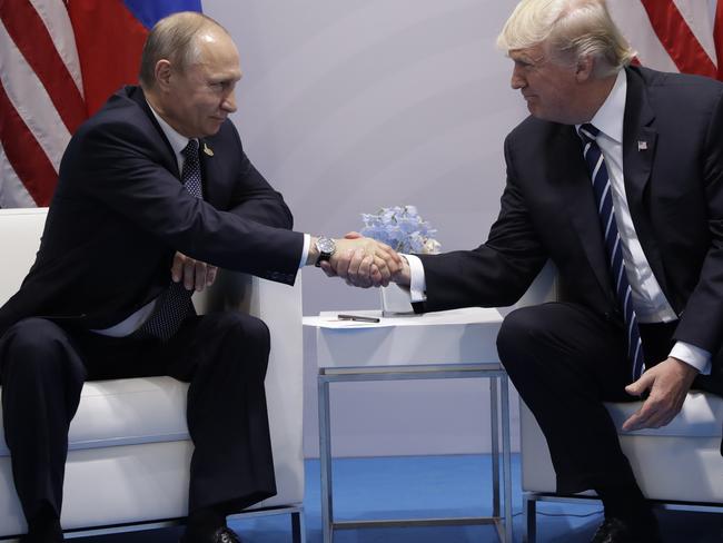 Macho Macho Men: President Trump and Putin met on the sidelines of the G20 in Germany. Picture Picture: Photo/Evan Vucci.