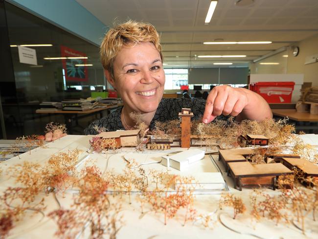 Karine Dupre is a popular Griffith University lecturer is a leader in her field at the architectural design program. She has been nominated by at least 24 of her students for the education award. Karine with one of her students work. Picture Glenn Hampson