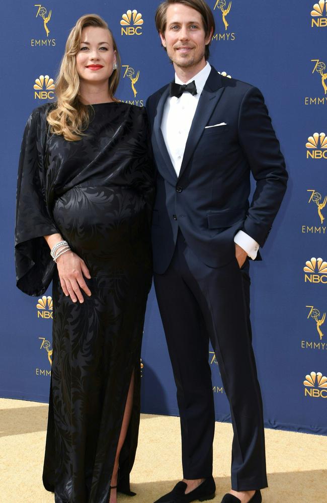 Supporting actress in a drama series nominee Yvonne Strahovski and Tim Loden arrive for the 70th Emmy Awards. Picture: AFP