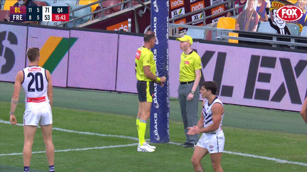 The goal umpires were caught in an awkward conversation.