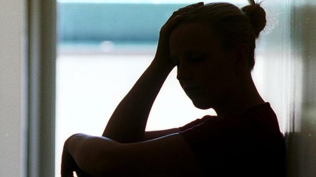 21 Dec 2001 Silhouette of young woman seated in doorway, date rape victim in Adelaide. Sexual Assault crime sa sex generic