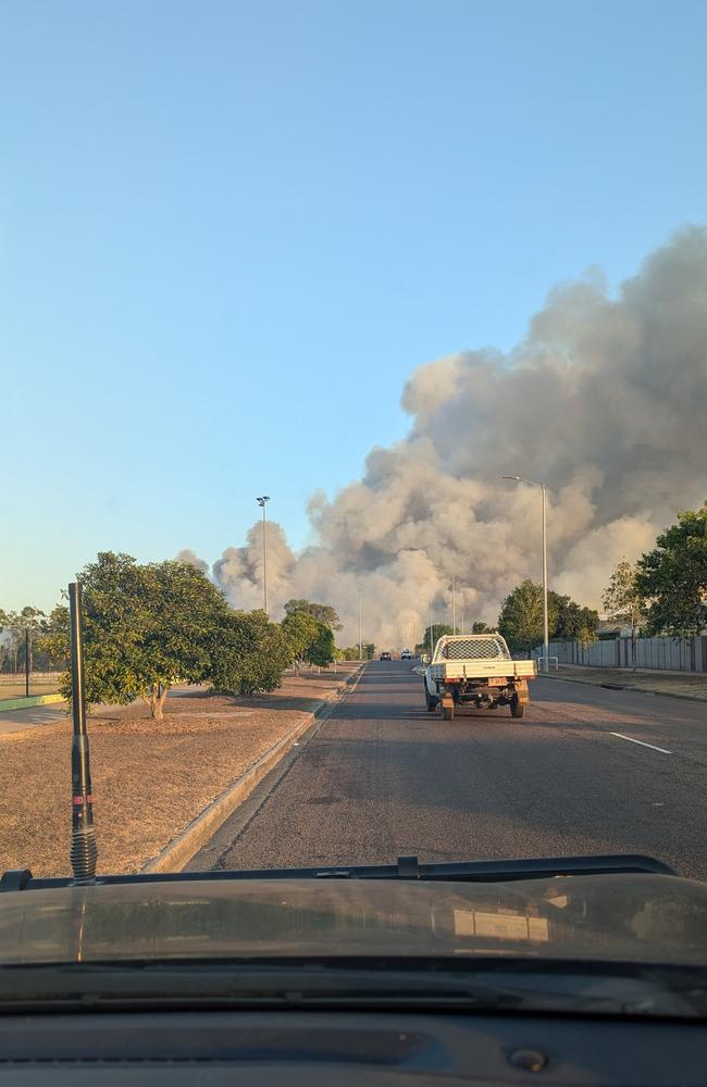 A significant scrub fire burning at the edge of Palmerston on the evening of Monday, September 2, 2024. Picture: Alex Treacy