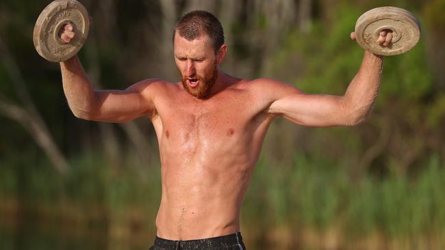 Essendon captain Dyson Heppell works out on the beach in Coffs Harbour.