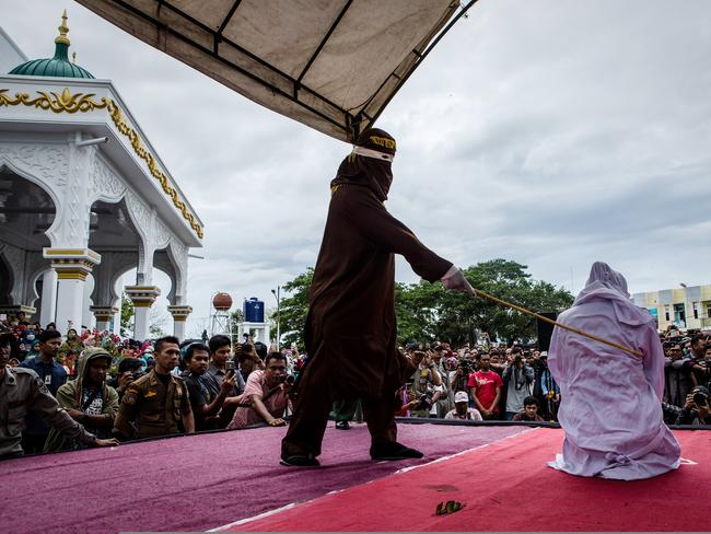 An Acehnese person gets caning in public from an executor in Banda Aceh, Indonesia, last year. Picture: Ulet Ifansasti/Getty Images