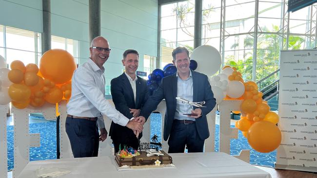 Richard Barker (Cairns Airport), Karl Schubert (Singapore Airlines) and Mark Olsen (Tourism Tropical North Queensland) cut a cake celebrating the return of international travel and visitors to Cairns. Picture: Yashee Sharma