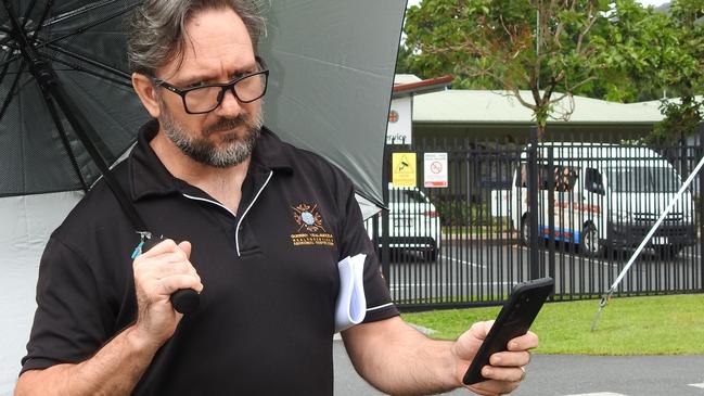 Gurriny Yealamucka Health Services director of clinical services Dr Jason King, tries in vain to access mobile coverage in Yarrabah. Picture: Supplied