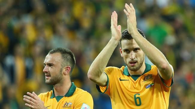 MELBOURNE, AUSTRALIA - JANUARY 09: Ivan Franjic and Matthew Spiranovic of Australia celebrate after Australia defeated Kuwait during the 2015 Asian Cup match between the Australian Socceroos and Kuwait at AAMI Park on January 9, 2015 in Melbourne, Australia. (Photo by Robert Cianflone/Getty Images)