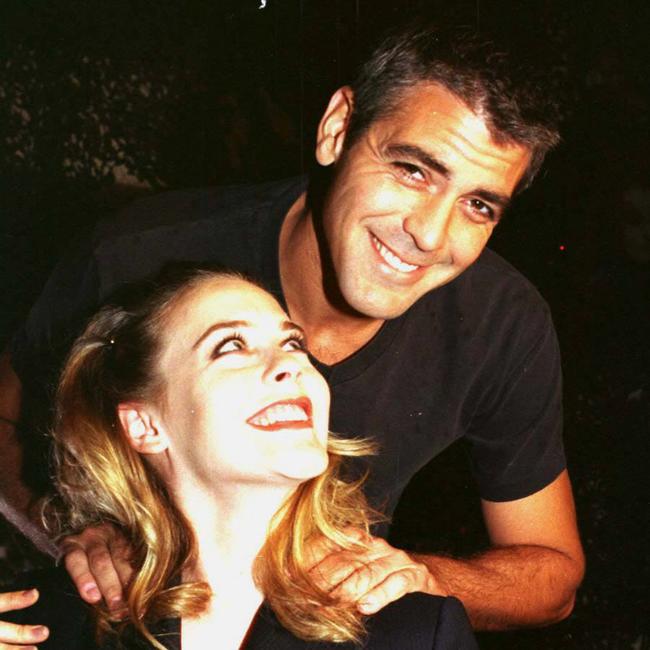 George Clooney and Alicia Silverstone inside Rick's Cafe at Movie World
