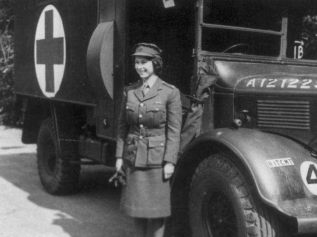 Princess Elizabeth, later Queen Elizabeth II, standing in front of an army truck during World War 2 on April 10, 1945.