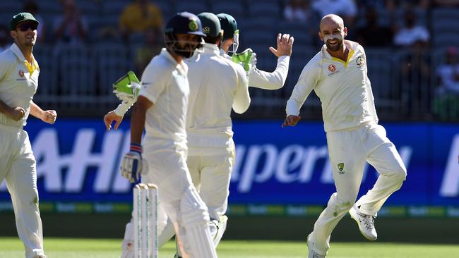 Nathan Lyon celebrates Virat Kohli’s wicket. Picture: AFP