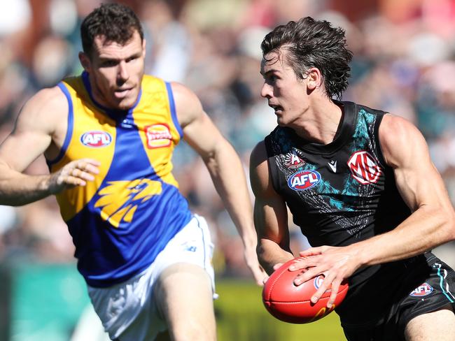 ADELAIDE, AUSTRALIA - APRIL 22: Connor Rozee of the Power and Luke Shuey of the Eagles during the 2023 AFL Round 06 match between the Port Adelaide Power and the West Coast Eagles at Adelaide Oval on April 22, 2023 in Adelaide, Australia. (Photo by Sarah Reed/AFL Photos via Getty Images)