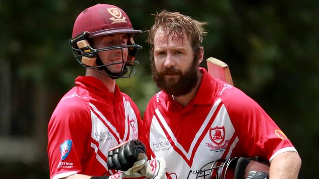 English cricketer Mark Stoneman of St George celebrates his century with Luke Bartier. Pic: Jeremy Ng