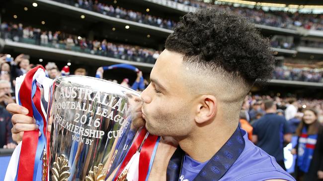 Western Bulldogs Jason Johannisen kisses the premiership cup after winning the Norm Smith medal. Picture: David Caird