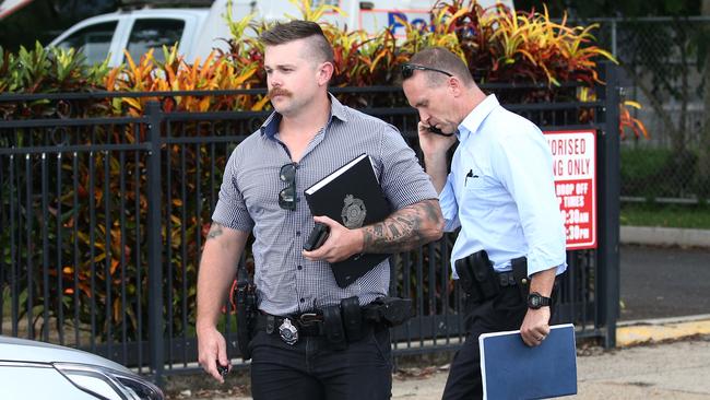 Police officers attend Hambledon State School at Edmonton, where a 3 year old was found dead in a Goodstart Early Learning Centre minibus at around 3:30pm on Tuesday. Detectives leave the scene. PICTURE: BRENDAN RADKE