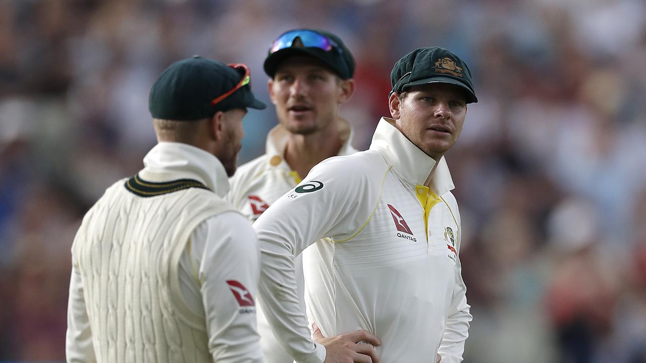 BIRMINGHAM, ENGLAND – AUGUST 02: David Warner, Cameron Bancroft and Steve Smith of Australia look on as the England supporters sing songs related to their ball tampering ban during day two of the 1st Specsavers Ashes Test between England and Australia at Edgbaston at Edgbaston on August 02, 2019 in Birmingham, England. (Photo by Ryan Pierse/Getty Images)