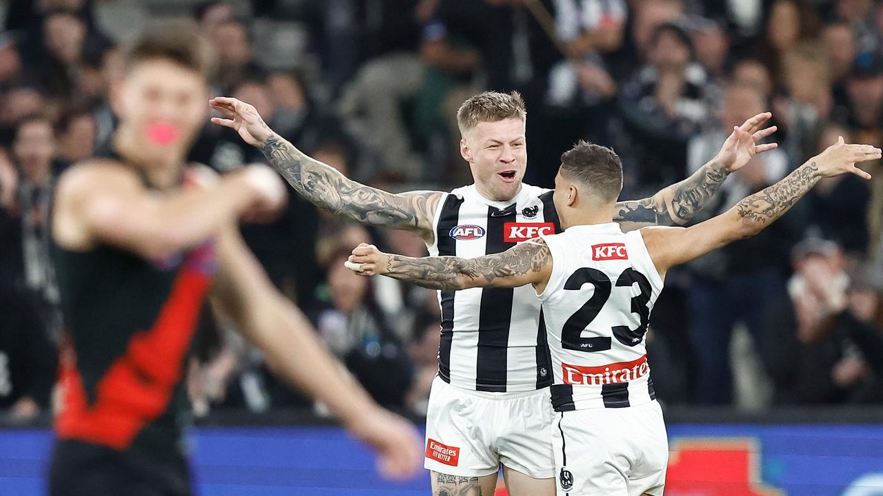 Jordan De Goey (left) and Bobby Hill enjoy a goal during Collingwood’s first-half demolition. Picture: Michael Willson/AFL Photos via Getty Images.