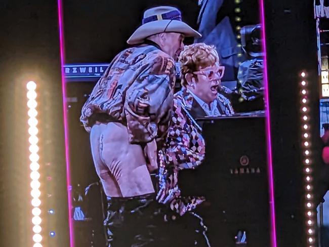 Molly Meldrum drops his pants on stage at an Elton John concert.