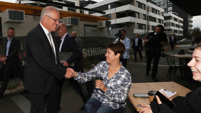 Scott Morrison speaks with Michelle and Samantha McKechnie in Western Sydney. Picture: Gary Ramage