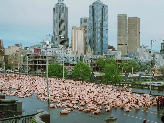 Naked men and women posing on the banks of the Yarra River for artist photographer Spencer Tunick in 2001.