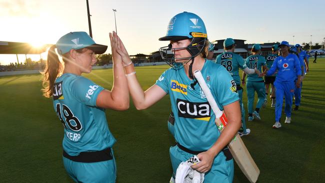 Jessica Jonassen (right) of the Heat celebrates with Amelia Kerr (left) after winning the WBBL Cricket match between Brisbane Heat and Adelaide Strikers at Harrup Park Country Club in Mackay, Queensland, Sunday, November 3, 2019. Picture: Darren England