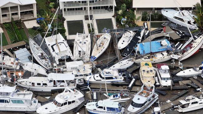 These iconic pictures taken by Townsville Bulletin photographer Evan Morgan of Cyclone Yasi’s destruction went around the world. Unfortunately for the residents of Port Hinchinbrook, the homes and boats in these pictures were theirs. Picture: Evan Morgan