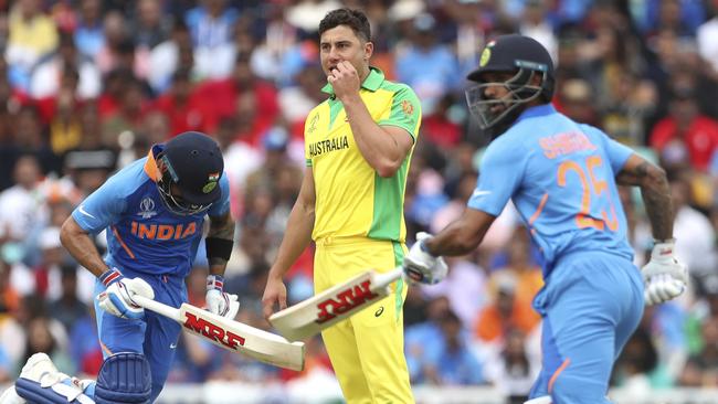 Australia's Marcus Stoinis, C, has suffered a side strain injury. Picture: AP