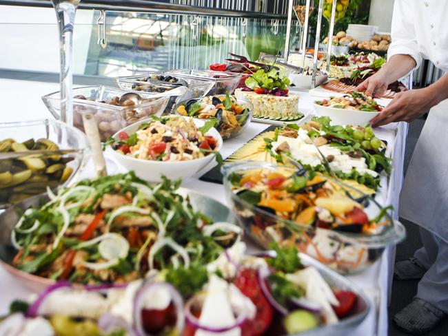 Waiter serving a buffet table