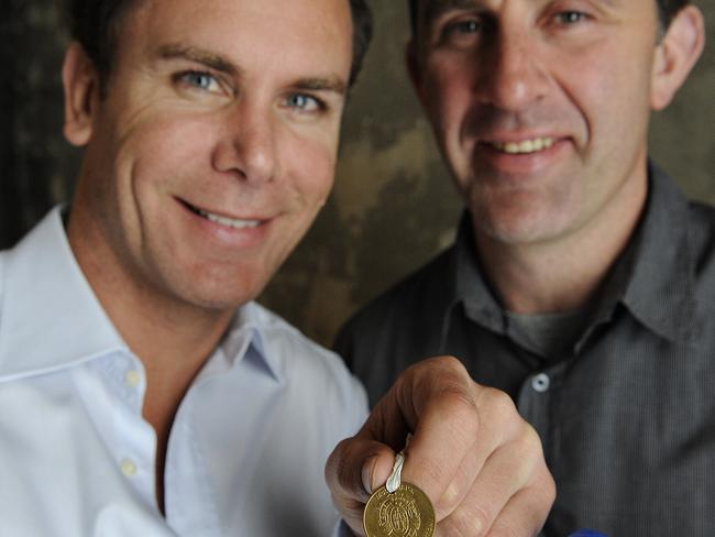 Wayne Carey and Corey McKernan with the plastic McDonald’s Brownlow Medal.